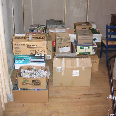 In the delightful surrounds of the bungalow, boxes full of stuff await loading Piles of boxes