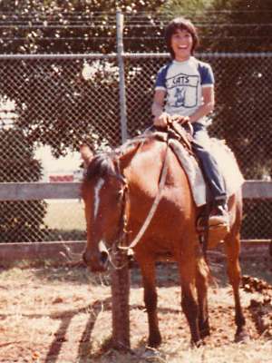 Daniel in Cats t-shirt on a horse, circa 1982