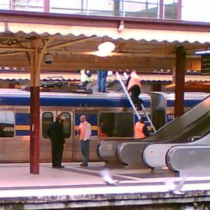 Connex staff climbing on roof of train