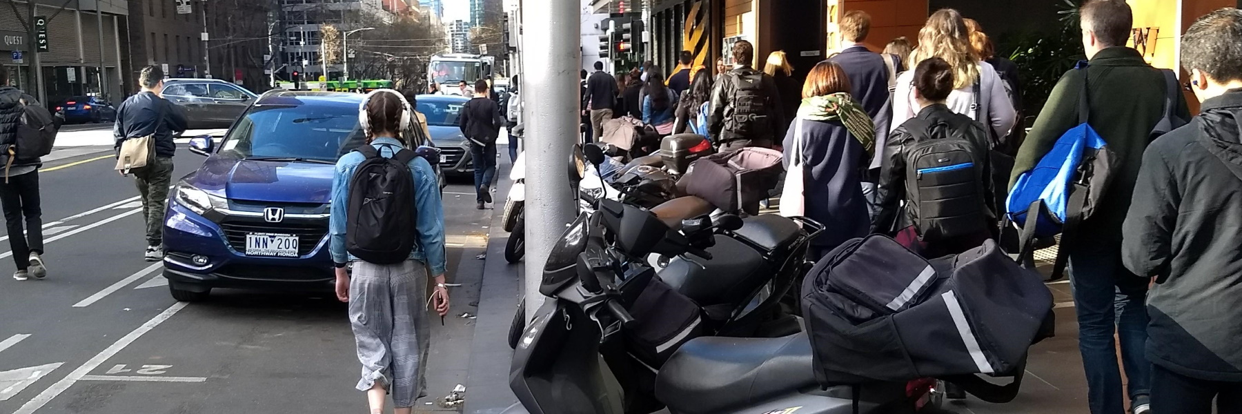 Motorcycles blocking footpath, William Street