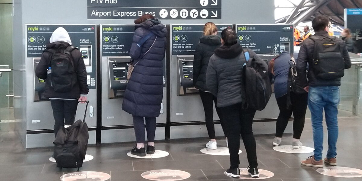 People using Myki vending machines